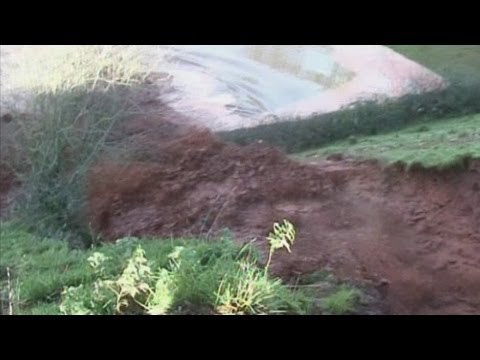 Submerged roads and burst rivers as bad weather strikes North Wales and England